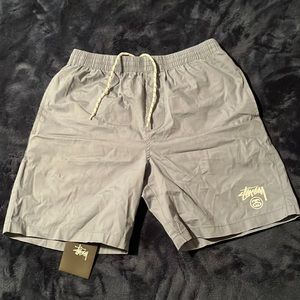 Men’s small like new Stussy shorts- greyish blue.